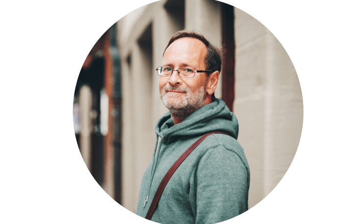 Middle aged man looking in camera outdoors